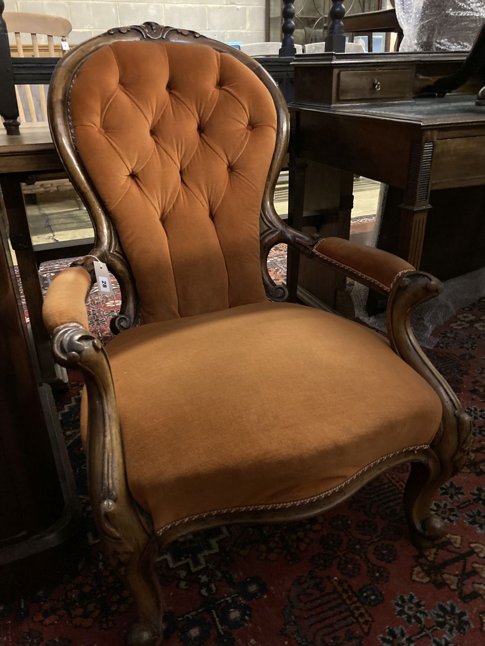 A Victorian walnut spoonback open armchair, width 66cm, depth 80cm, height 90cm